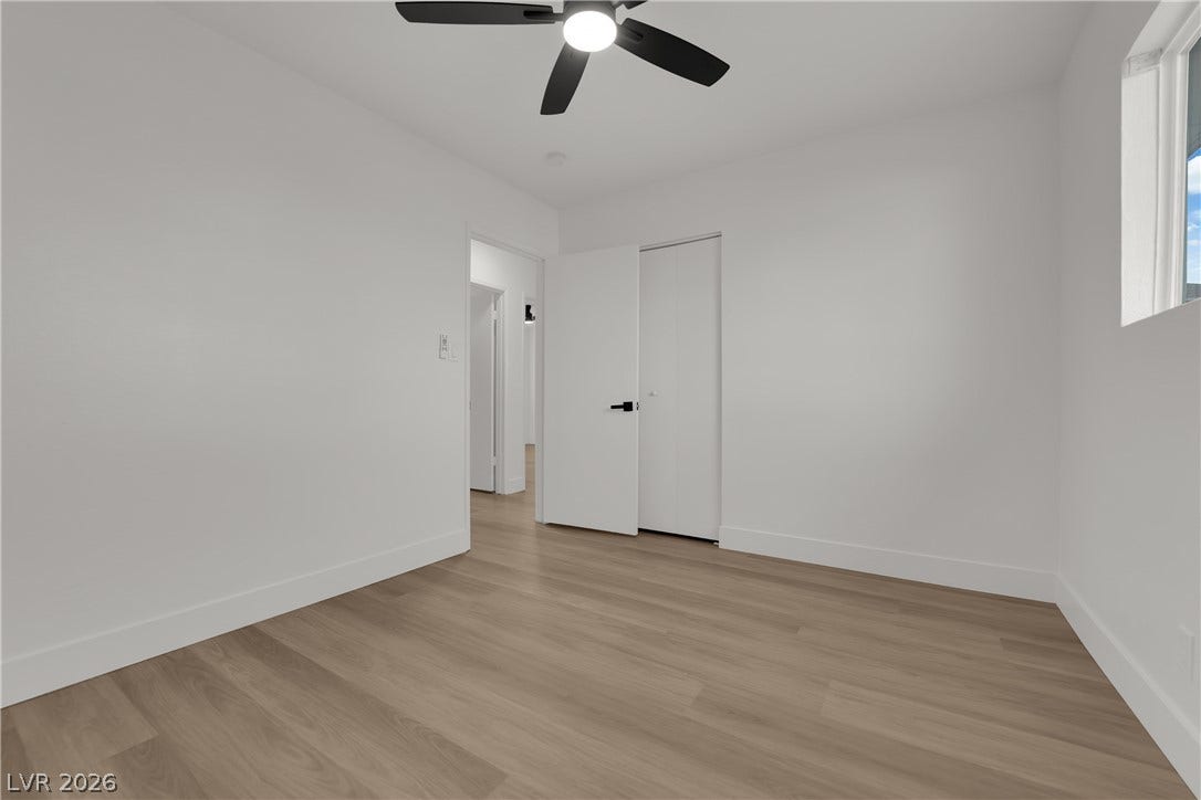 419 Scenic Drive, Henderson, NV 89002 Smooth wood floors and crisp minimalist architecture define this inviting bedroom space.