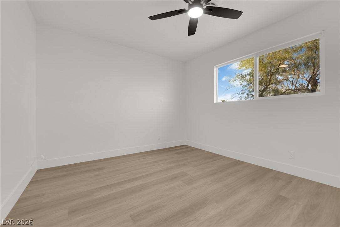419 Scenic Drive, Henderson, NV 89002 Clean lines and warm wood floors define this versatile bedroom space.