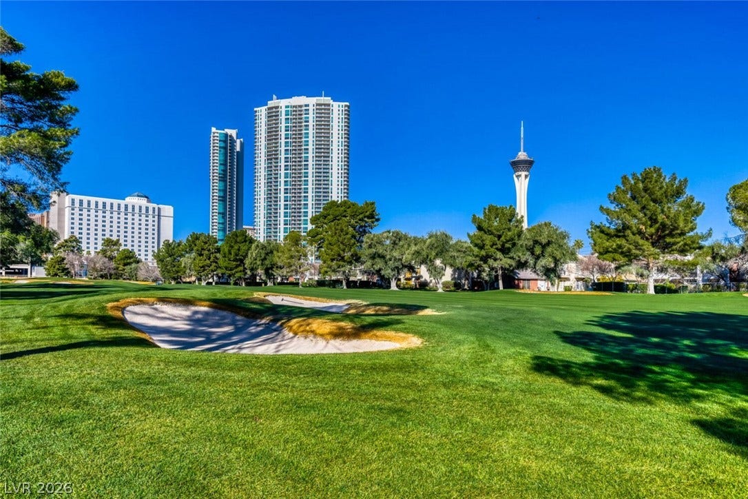769 Oakmont Avenue, #403, Las Vegas, NV 89109 Lush fairways offer scenic golf course views framed by iconic city high-rises.