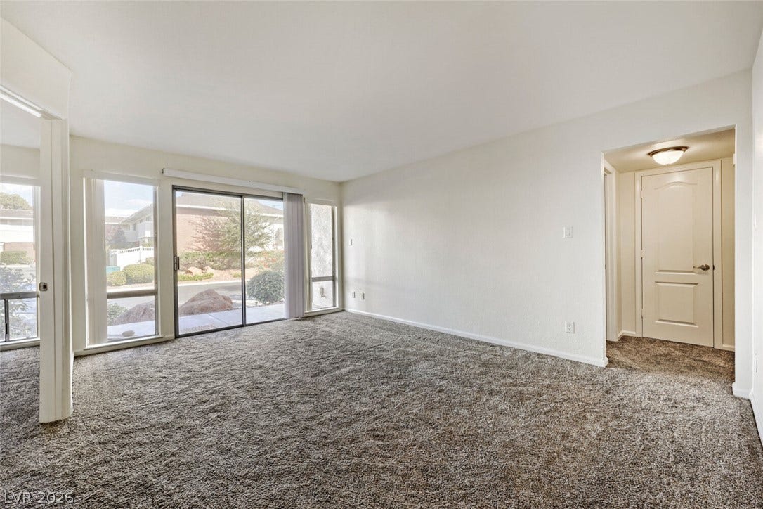 769 Oakmont Avenue, #403, Las Vegas, NV 89109 Sliding glass doors open to the outdoors from the main living area.