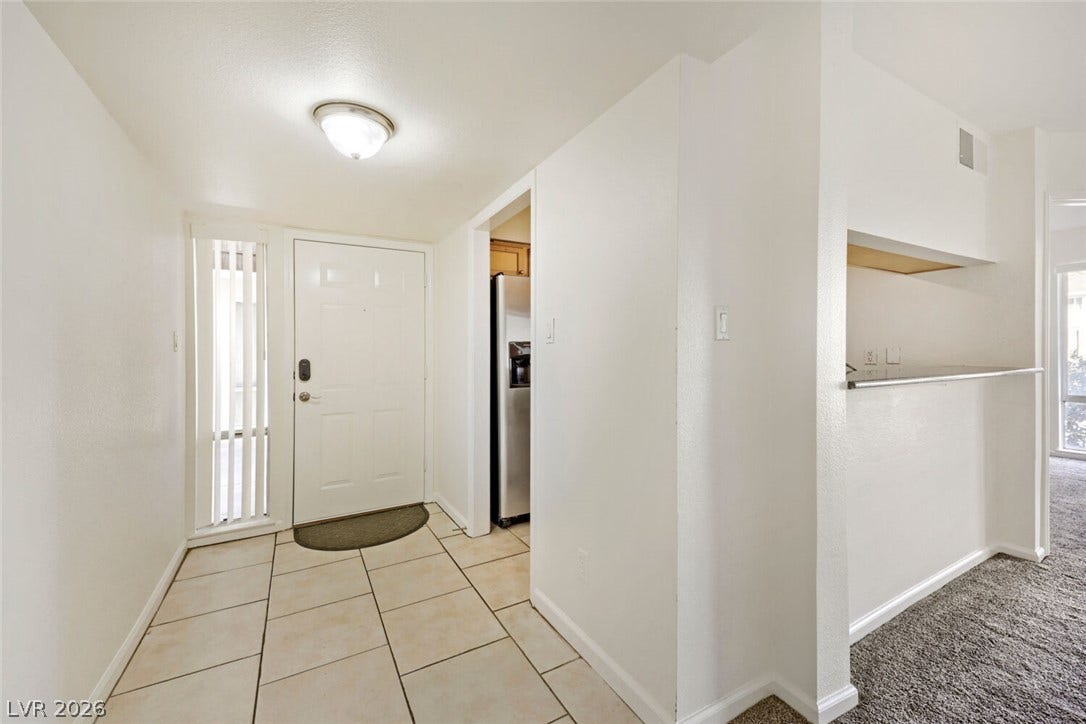 769 Oakmont Avenue, #403, Las Vegas, NV 89109 Tiled entryway floors transition smoothly into carpeted living areas.