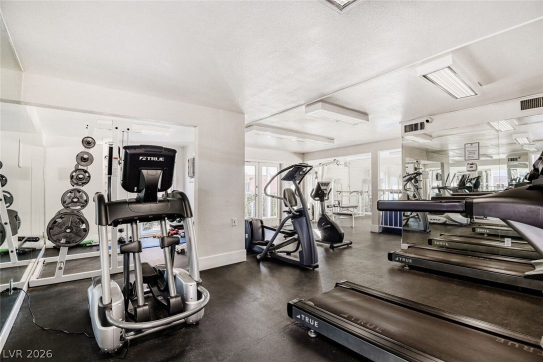 769 Oakmont Avenue, #403, Las Vegas, NV 89109 Mirrored walls and recessed lighting define this well-equipped home fitness space.