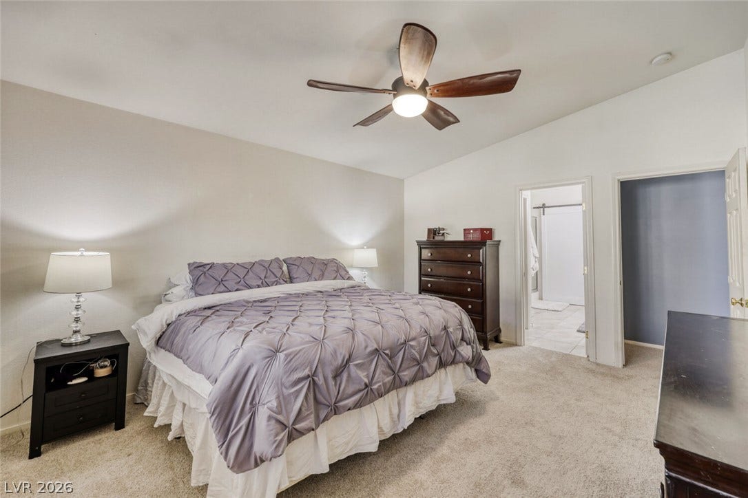 5817 Hawkeye Bell Street, North Las Vegas, NV 89081 Vaulted ceilings and soft carpeting create a serene atmosphere in this restful retreat.