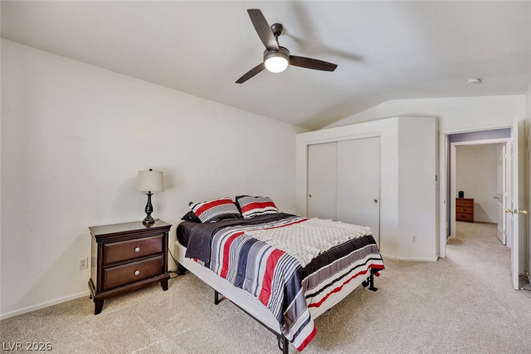 5817 Hawkeye Bell Street, North Las Vegas, NV 89081 Vaulted ceilings and soft wall-to-wall carpeting define this peaceful sleeping space.