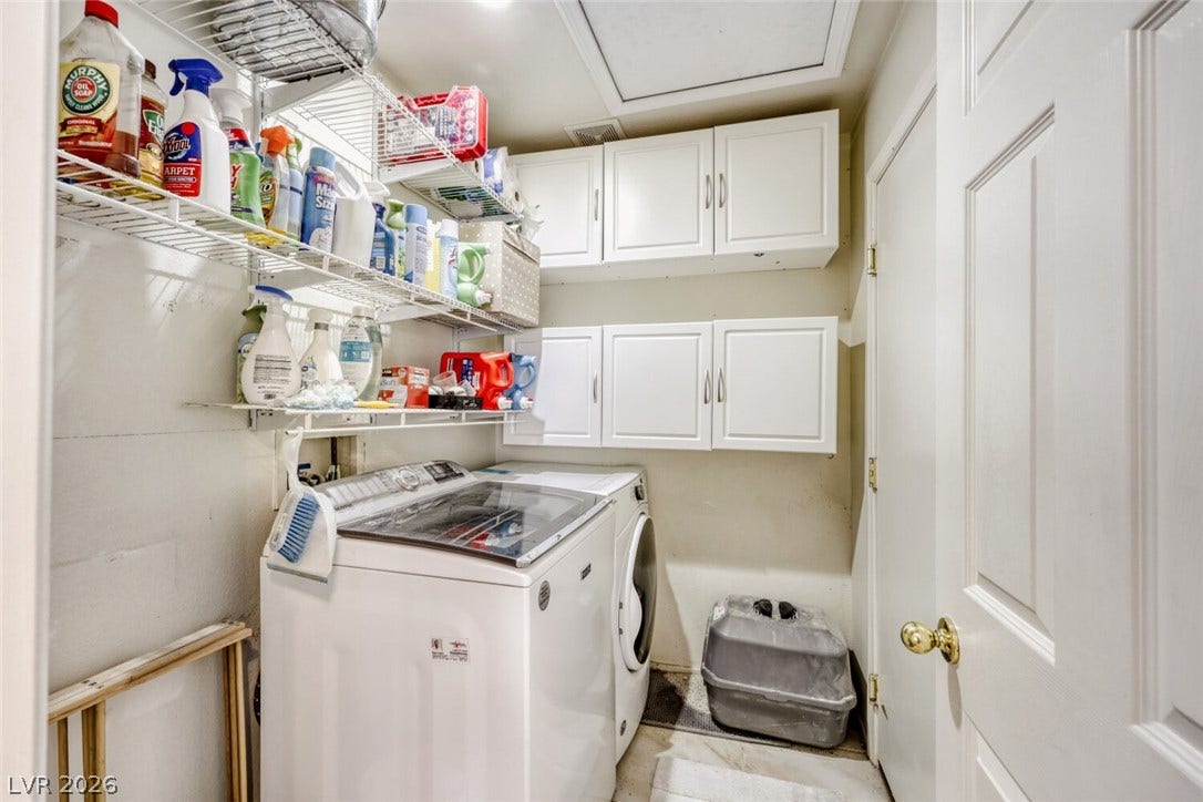 5817 Hawkeye Bell Street, North Las Vegas, NV 89081 Ample wall cabinetry and sturdy wire shelving maximize utility in this functional laundry space.
