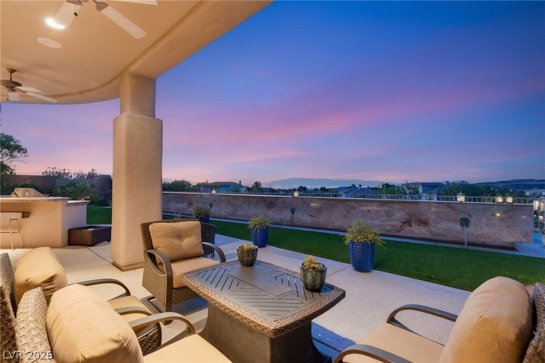 6 Brookridge Drive, Henderson, NV 89052 A spacious covered patio opens to panoramic sunset views over the manicured yard.