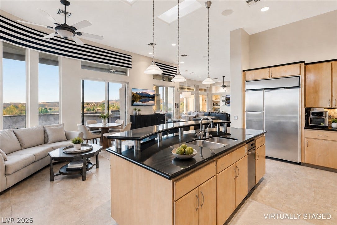 6 Brookridge Drive, Henderson, NV 89052 High ceilings and tall windows frame scenic hillside views in this open-concept layout.