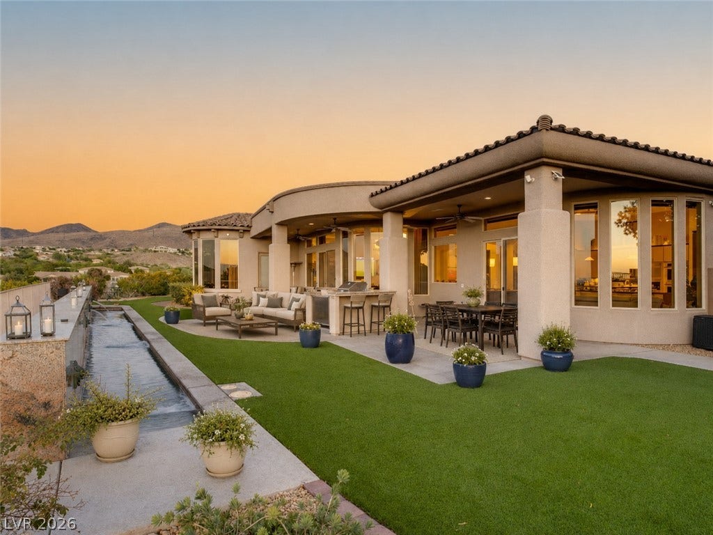 6 Brookridge Drive, Henderson, NV 89052 A spacious covered terrace overlooks manicured grounds and scenic mountain vistas.