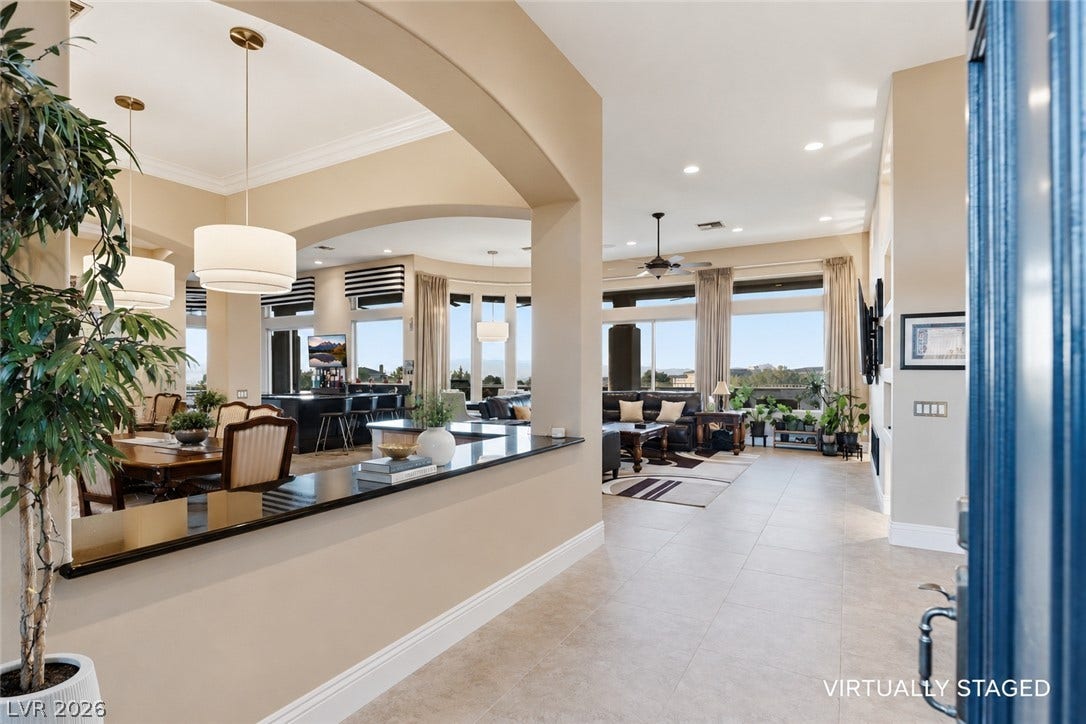 6 Brookridge Drive, Henderson, NV 89052 An inviting entrance foyer reveals tiled flooring and elegant arched openings leading to living areas.