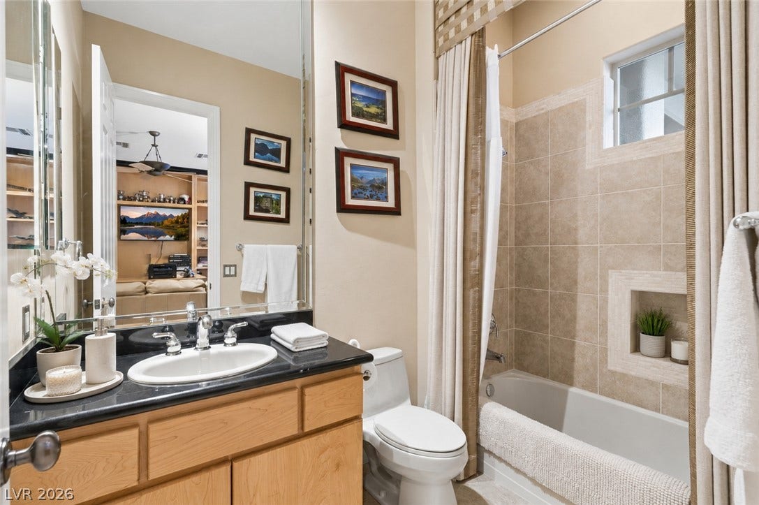 6 Brookridge Drive, Henderson, NV 89052 Tiled walls and granite counters bring refined texture to this full bathroom.