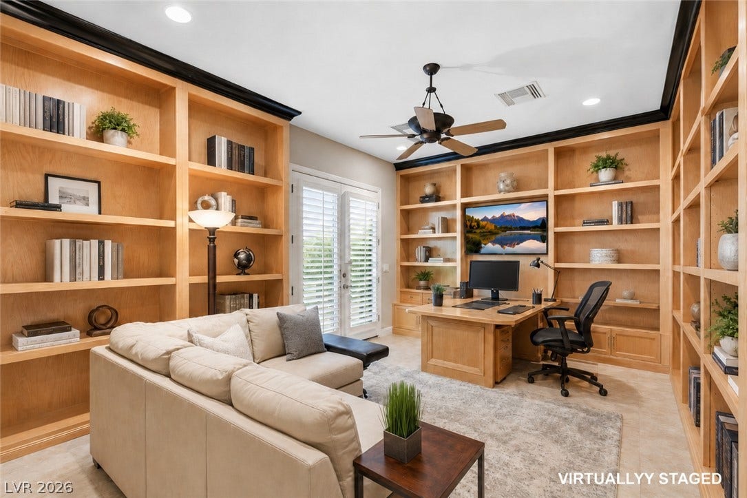 6 Brookridge Drive, Henderson, NV 89052 Floor-to-ceiling wooden bookcases surround this executive study complete with French doors and recessed lighting.