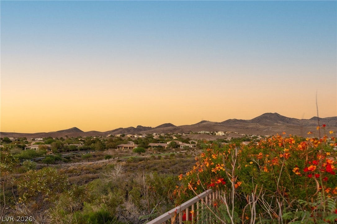6 Brookridge Drive, Henderson, NV 89052 Distant mountains frame the quiet residential valley under a soft evening sky.