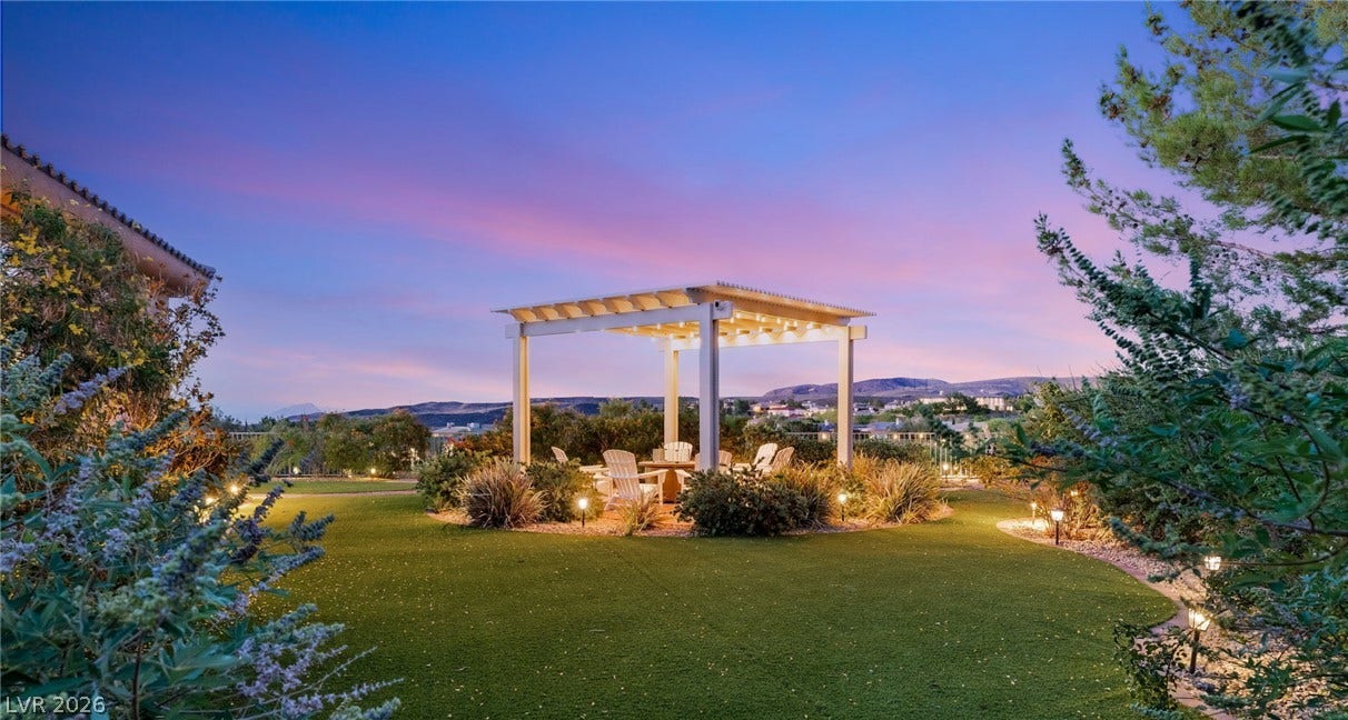 6 Brookridge Drive, Henderson, NV 89052 An elegant pergola rises in the manicured yard, framing distant mountain and neighborhood vistas.