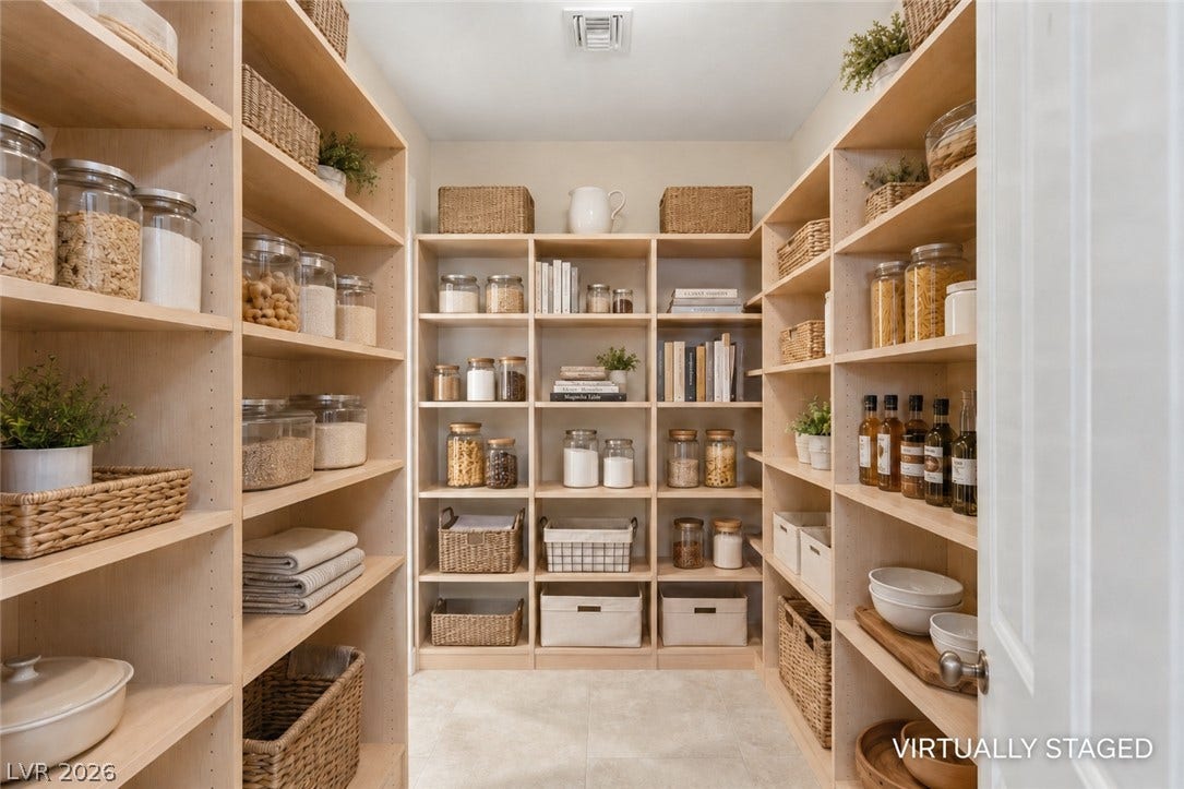 6 Brookridge Drive, Henderson, NV 89052 A well-organized walk-in pantry provides floor-to-ceiling built-in shelving and tile flooring.