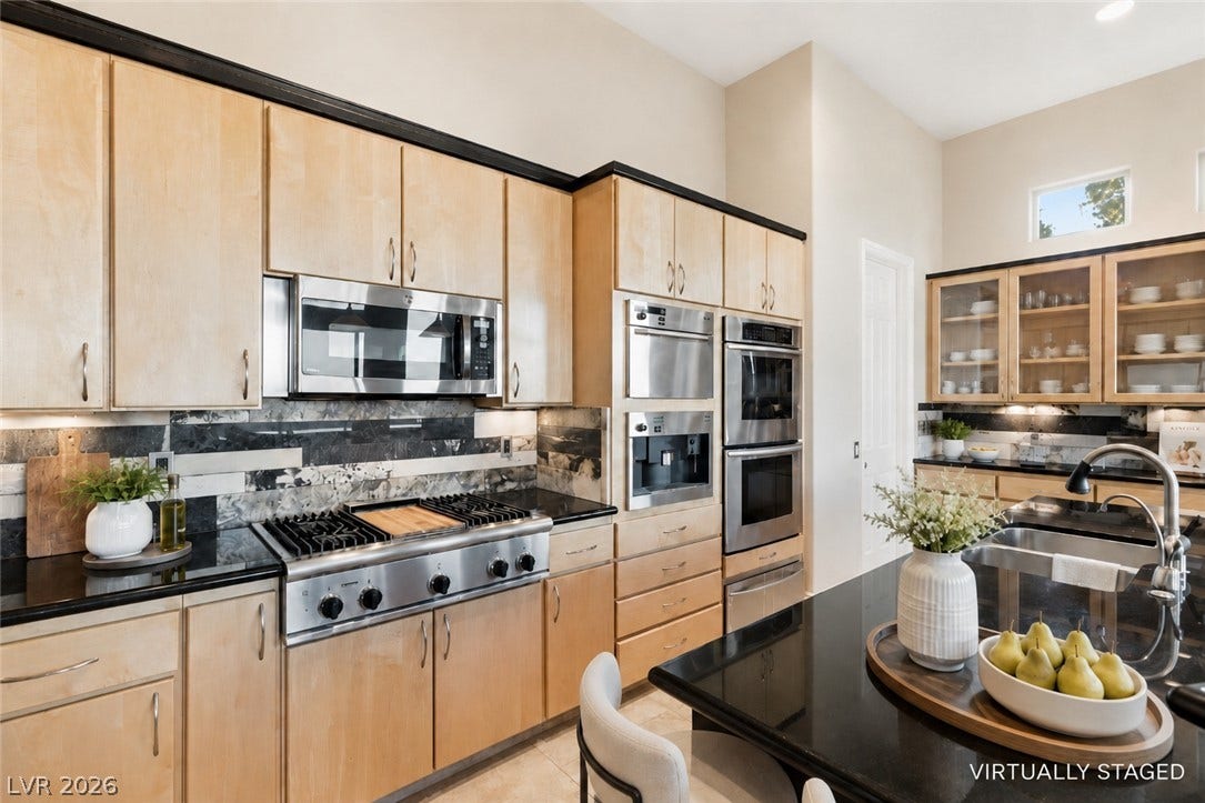 6 Brookridge Drive, Henderson, NV 89052 Gleaming stone countertops and custom cabinetry define this thoughtfully designed culinary space.
