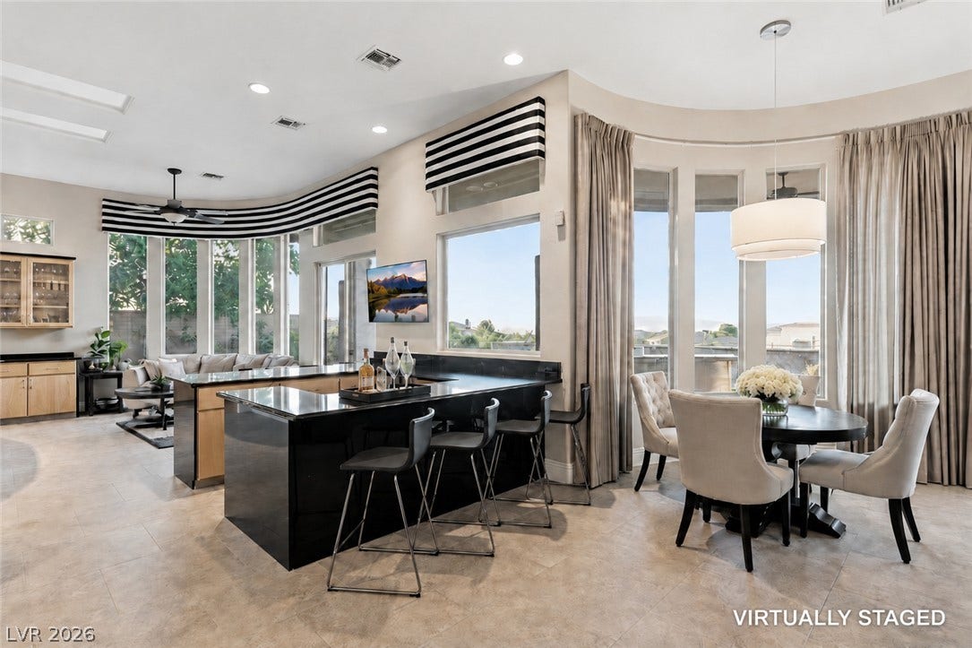 6 Brookridge Drive, Henderson, NV 89052 An open floorplan design seamlessly connects the wet bar, dining area, and spacious living spaces.