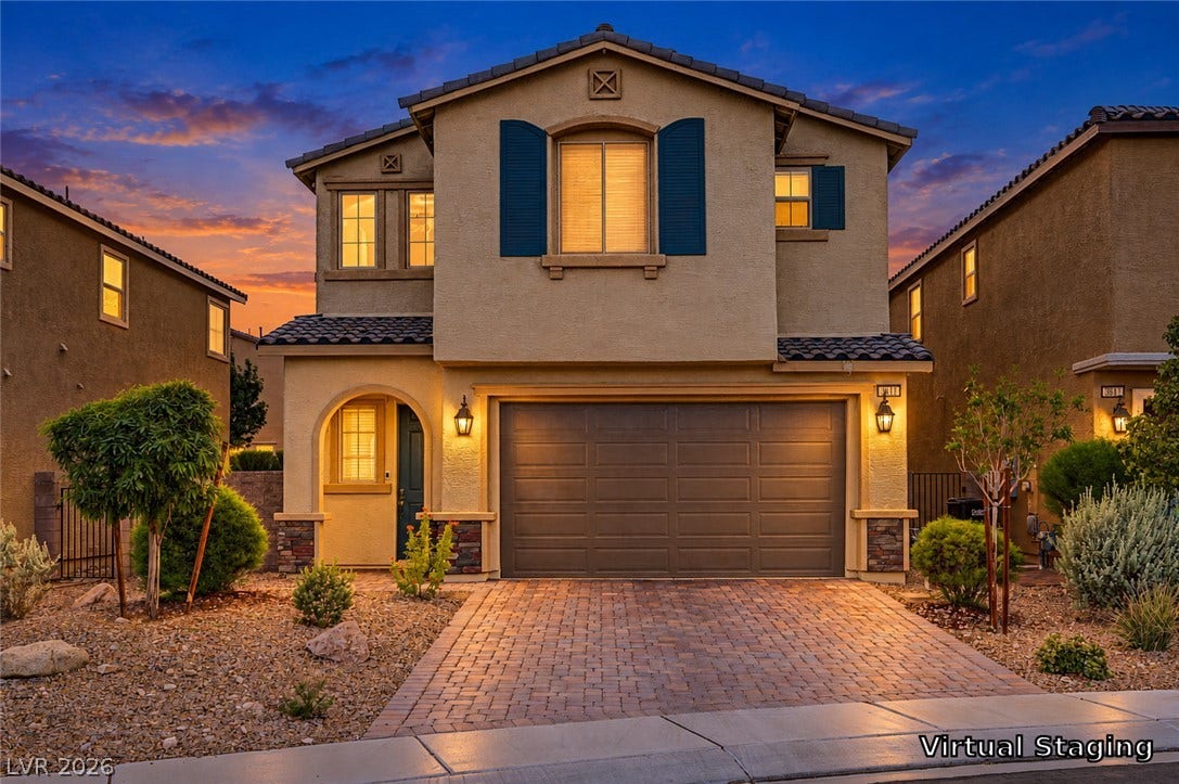3813 Birch River Street, North Las Vegas, NV 89032 A paved driveway leads to the integrated garage of this modern two-story home.