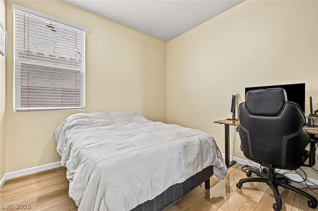 3813 Birch River Street, North Las Vegas, NV 89032 Smooth wood flooring and a large window define this versatile secondary bedroom space.