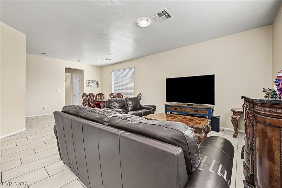 3813 Birch River Street, North Las Vegas, NV 89032 Gleaming tile floors and smooth neutral walls define this versatile open living space.