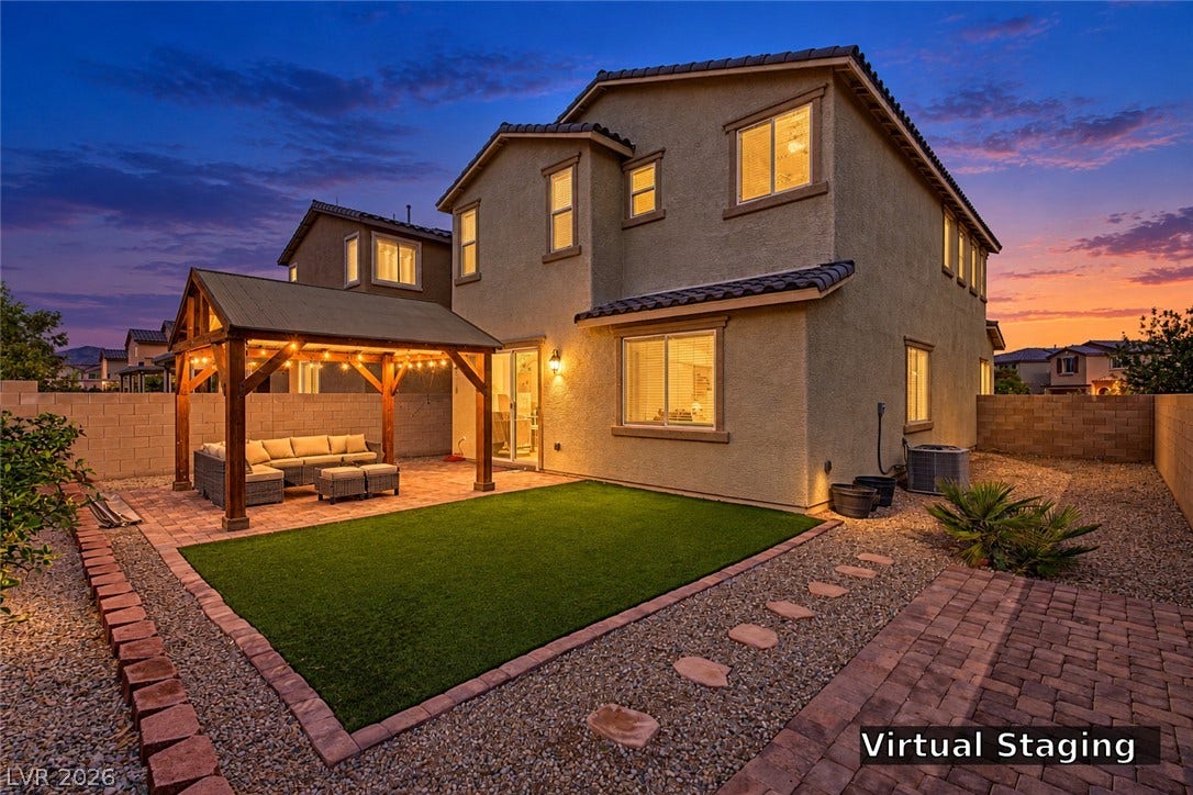 3813 Birch River Street, North Las Vegas, NV 89032 An inviting backyard patio and level lawn area set the stage for quiet evenings.
