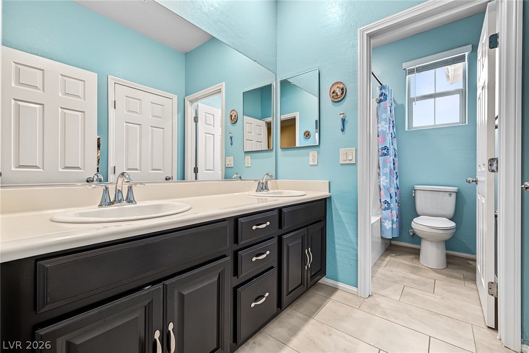 3813 Birch River Street, North Las Vegas, NV 89032 Double vanity highlights this functional bath, complete with a separate water closet and tile flooring.