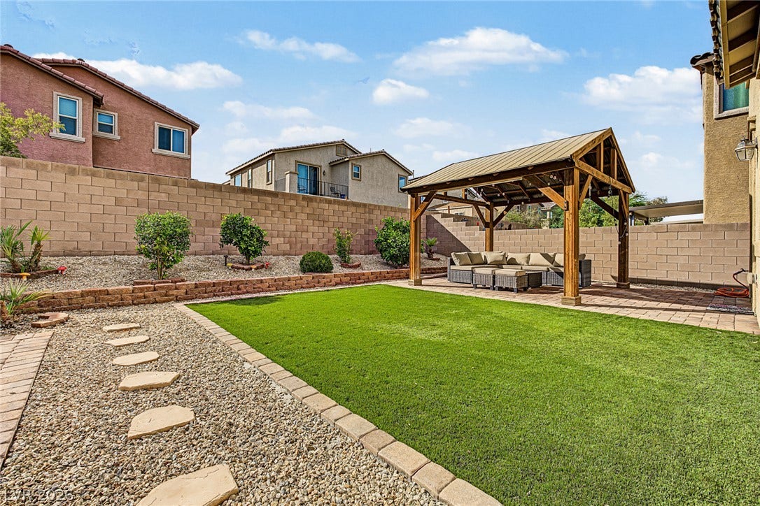 3813 Birch River Street, North Las Vegas, NV 89032 A structured timber pavilion anchors the manicured lawn of this terraced outdoor space.