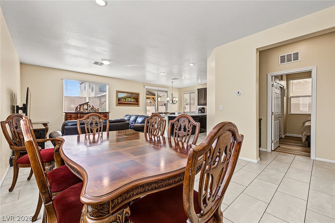 3813 Birch River Street, North Las Vegas, NV 89032 Polished tile flooring and an open layout seamlessly connect the formal and casual living spaces.