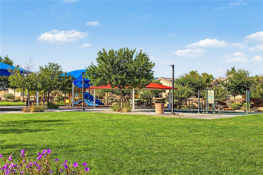 3813 Birch River Street, North Las Vegas, NV 89032 An inviting neighborhood park offers lush green lawns and structured play areas under open skies.