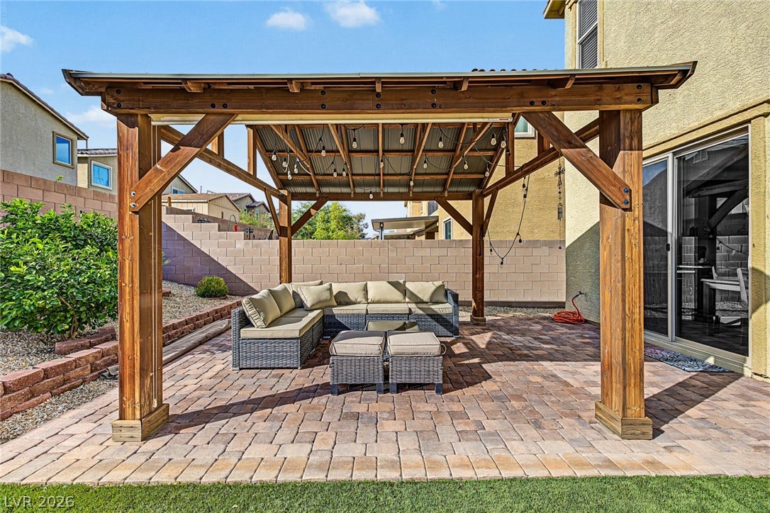 3813 Birch River Street, North Las Vegas, NV 89032 A sturdy wooden gazebo shelters a paved patio adjacent to the home.