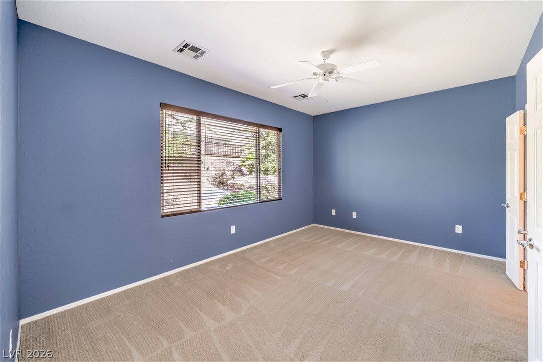 2488 Galaxy Cluster Street, Henderson, NV 89044 Owners Suite with Ceiling Fan, Walk-In Closet, and Bathroom with Dual Sinks, Shower, Linen Closet, and Tile Flooring