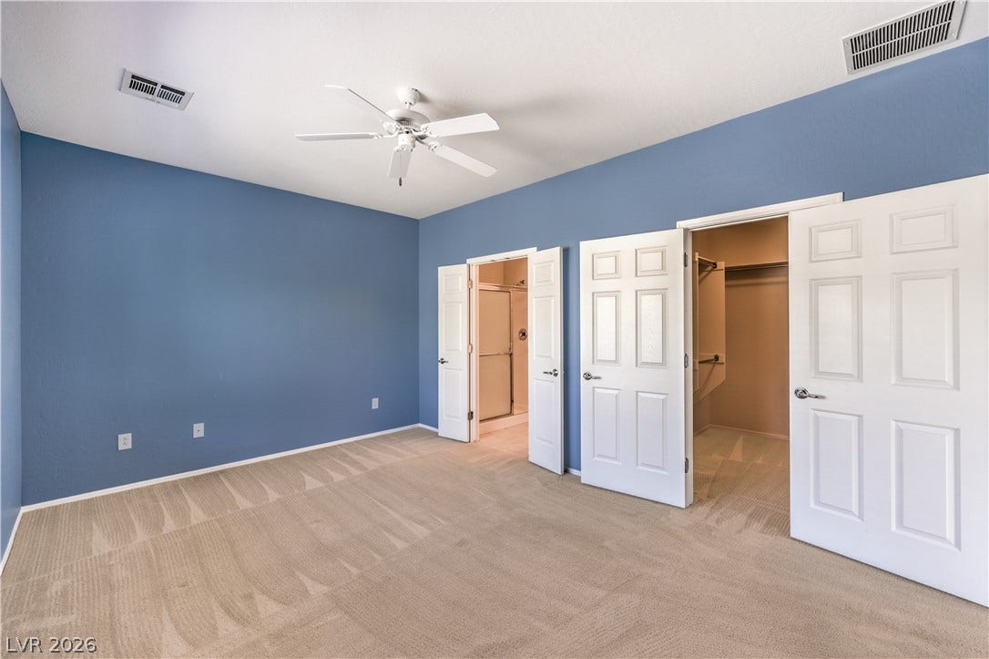 2488 Galaxy Cluster Street, Henderson, NV 89044 Owners Suite with Ceiling Fan, Walk-In Closet, and Bathroom with Dual Sinks, Shower, Linen Closet, and Tile Flooring