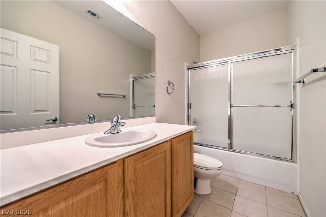 2488 Galaxy Cluster Street, Henderson, NV 89044 Secondary Bath with Raised Vanity, Tub/Shower Combination w/Enclosure, and Tile Flooring