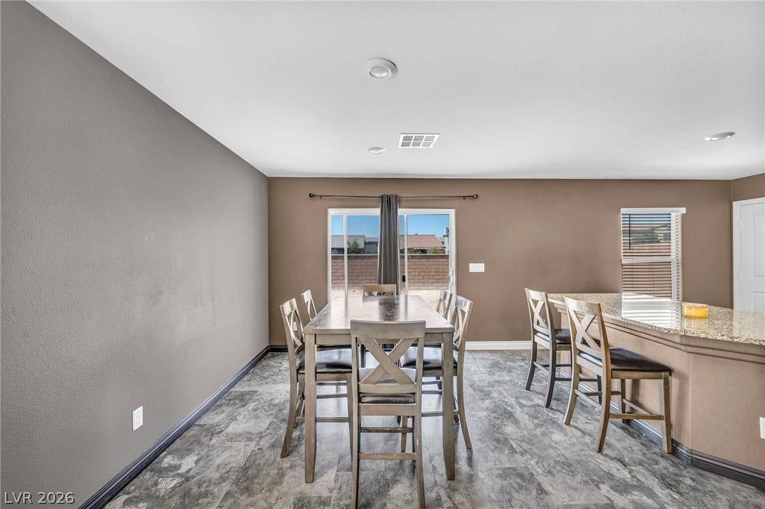 1205 Deep Valley Avenue, North Las Vegas, NV 89084 Granite counters and durable tile flooring highlight this open dining area.