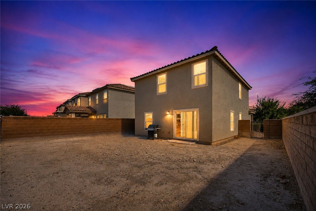 1205 Deep Valley Avenue, North Las Vegas, NV 89084 An expansive backyard space enclosed by block walls provides a blank canvas for personalization.