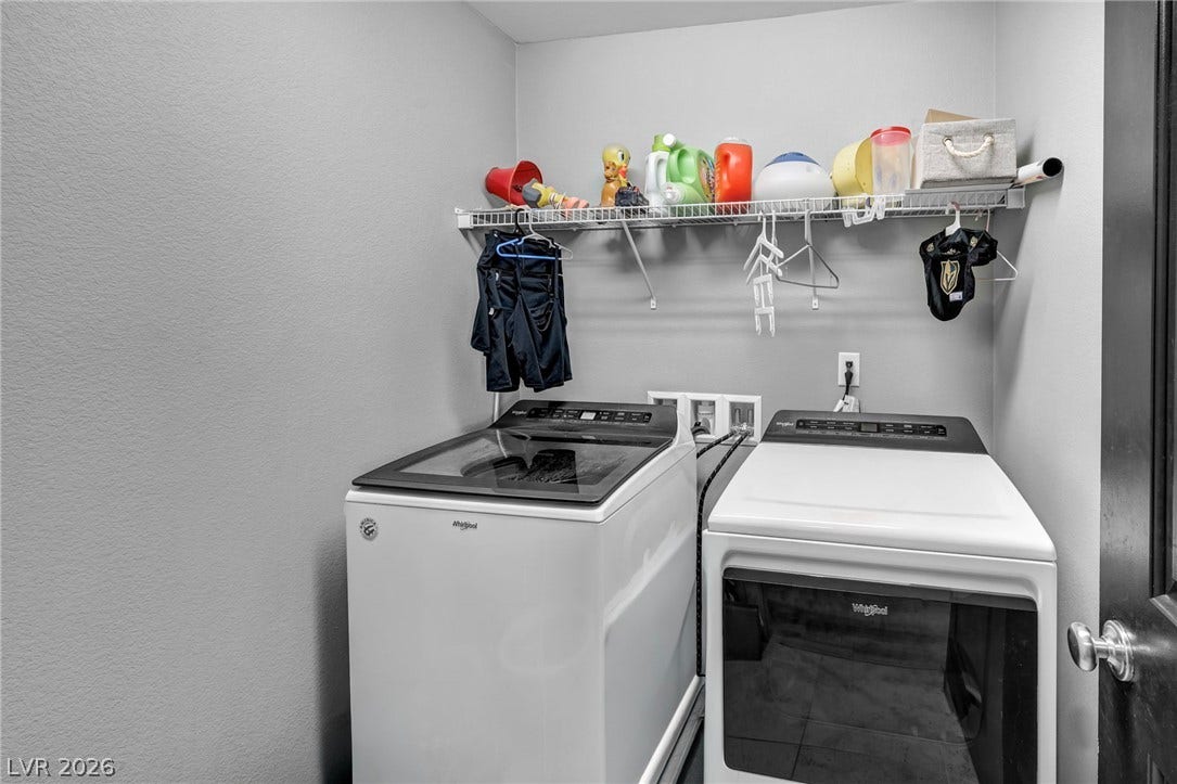 1205 Deep Valley Avenue, North Las Vegas, NV 89084 Functional utility space features overhead wire shelving and modern appliances.