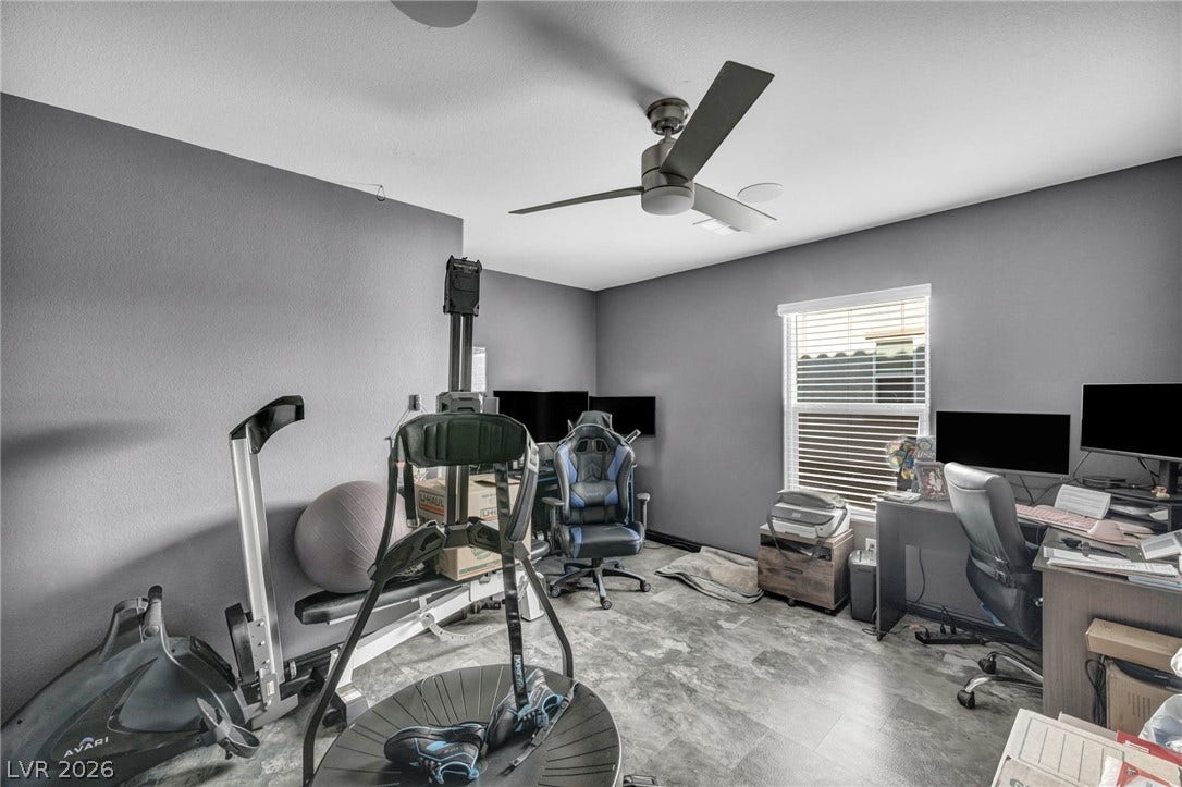 1205 Deep Valley Avenue, North Las Vegas, NV 89084 Versatile home workspace option showcasing durable modern flooring and generous window illumination.