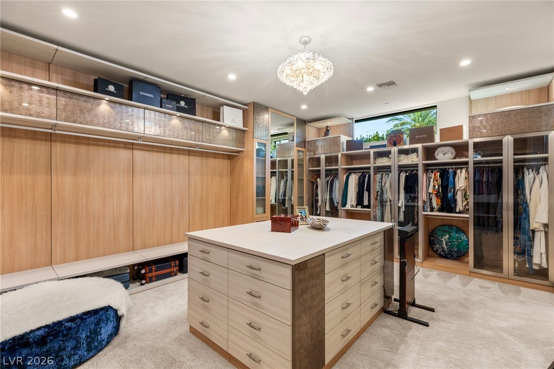 1269 Imperia Drive, Henderson, NV 89052 Ample custom cabinetry and a spacious central dresser island define this organized walk-in closet.