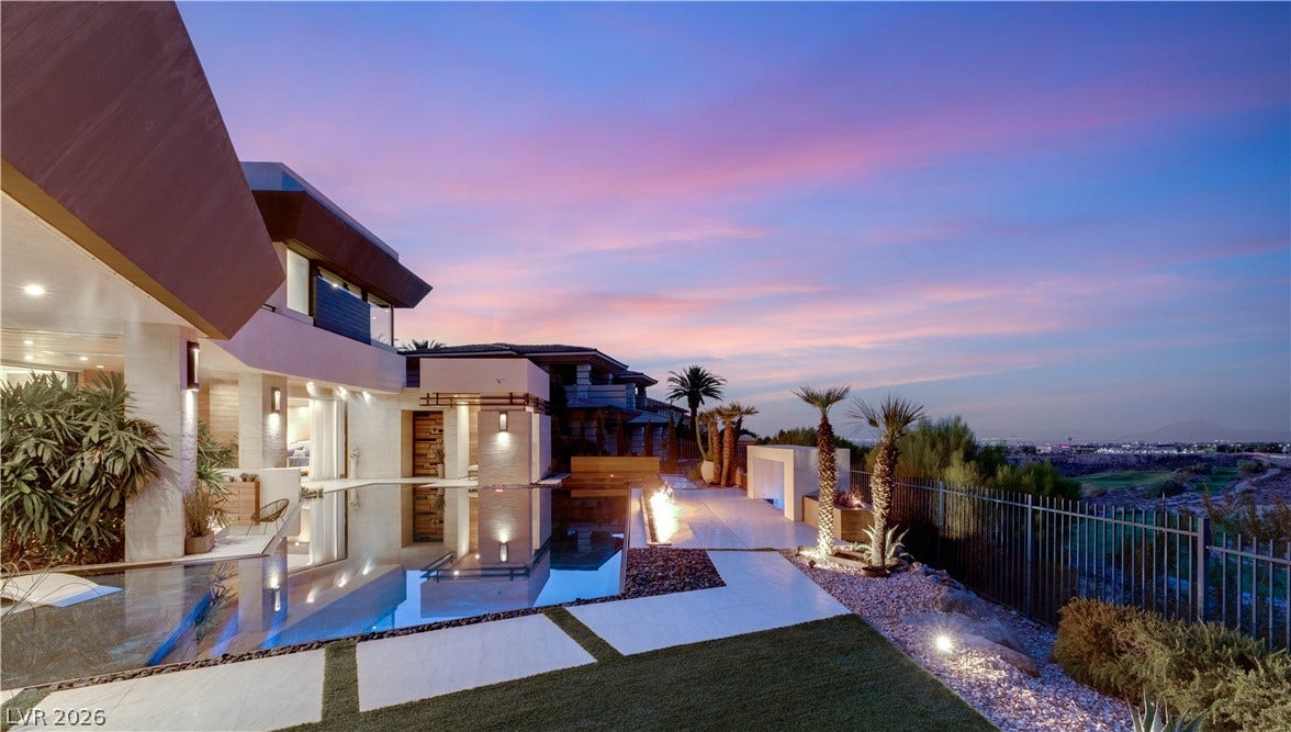 1269 Imperia Drive, Henderson, NV 89052 Striking architectural lines frame a sleek poolside terrace overlooking valley views at sunset.