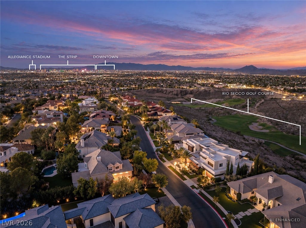 1269 Imperia Drive, Henderson, NV 89052 Dramatic sunset skies frame panoramic city lights, mountain ridges, and a neighboring golf course.