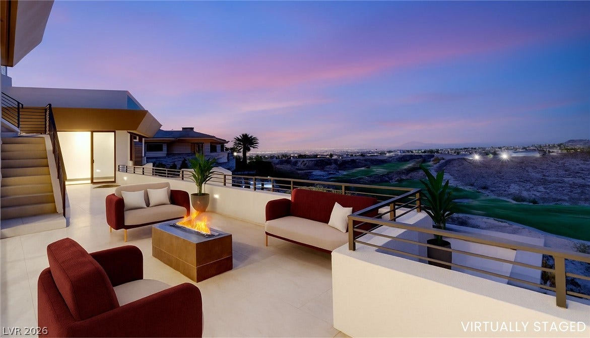 1269 Imperia Drive, Henderson, NV 89052 Panoramic mountain and city light views define this expansive outdoor terrace with tiled flooring.