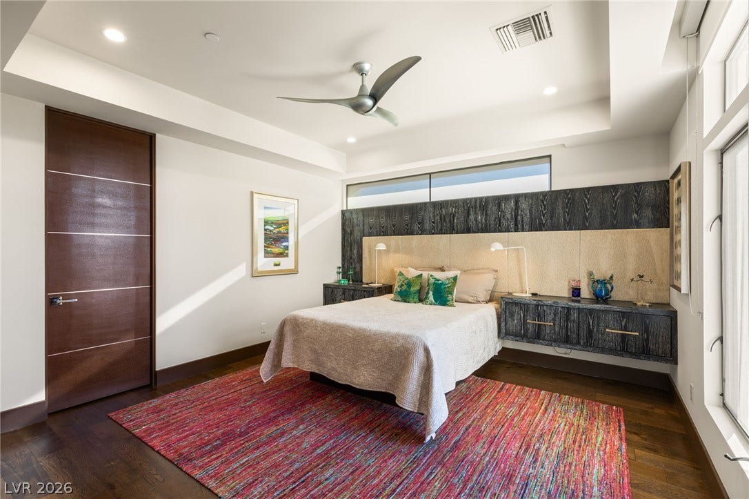 1269 Imperia Drive, Henderson, NV 89052 Clean lines and rich hardwood floors define this tranquil sleeping space with custom built-ins.