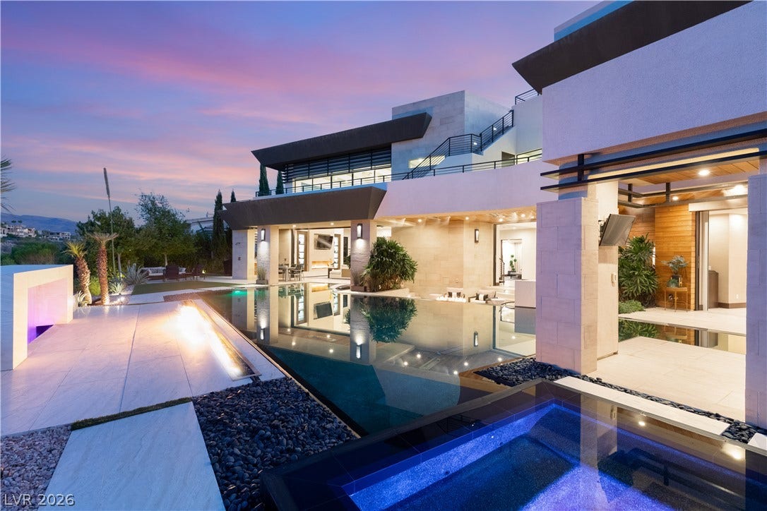 1269 Imperia Drive, Henderson, NV 89052 Striking contemporary architecture integrates seamless indoor-outdoor living spaces alongside a zero-edge pool.