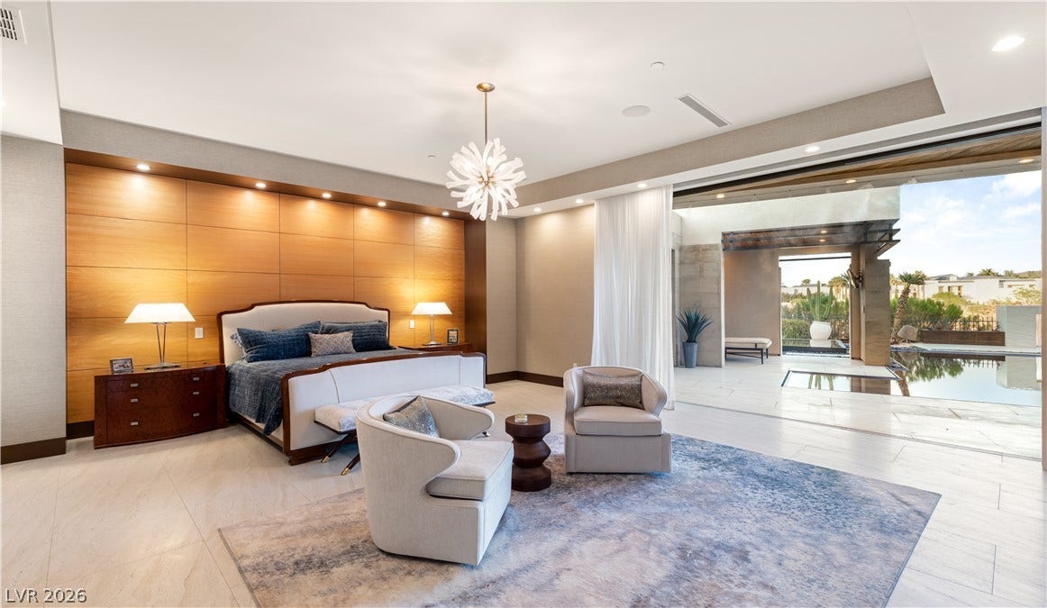 1269 Imperia Drive, Henderson, NV 89052 Retractable glass walls open this main bedroom suite directly to the poolside terrace.
