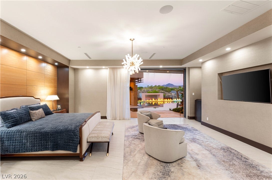 1269 Imperia Drive, Henderson, NV 89052 Retractable glass doors seamlessly connect this elegant space to the outdoor patio and pool area.