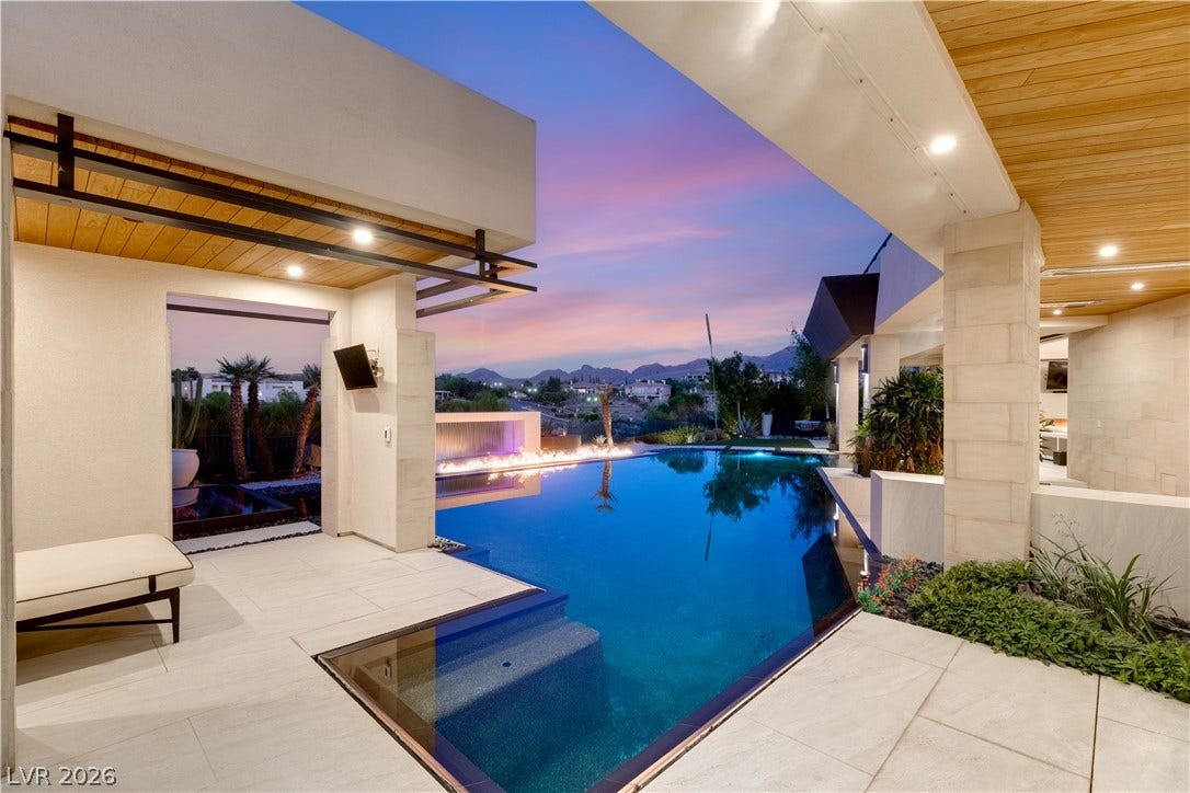 1269 Imperia Drive, Henderson, NV 89052 An zero-edge pool anchors this modern outdoor living area set against mountain views.