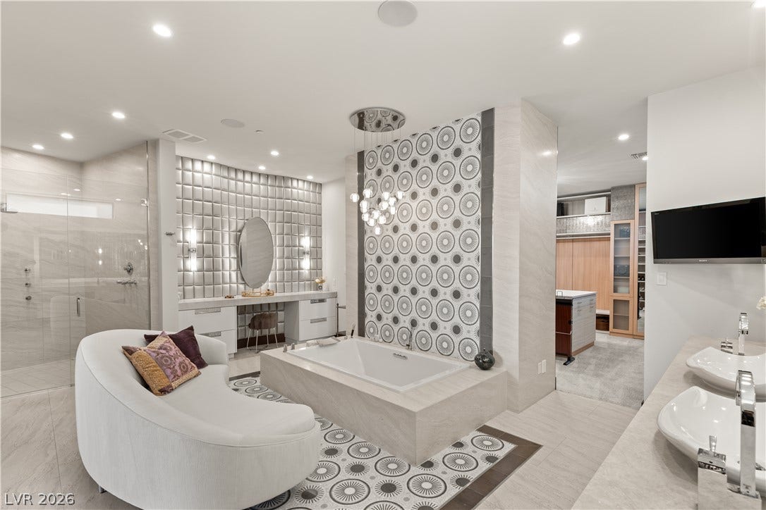 1269 Imperia Drive, Henderson, NV 89052 Gleaming tile floors and custom wall mosaics accent this luxurious main bath oasis.