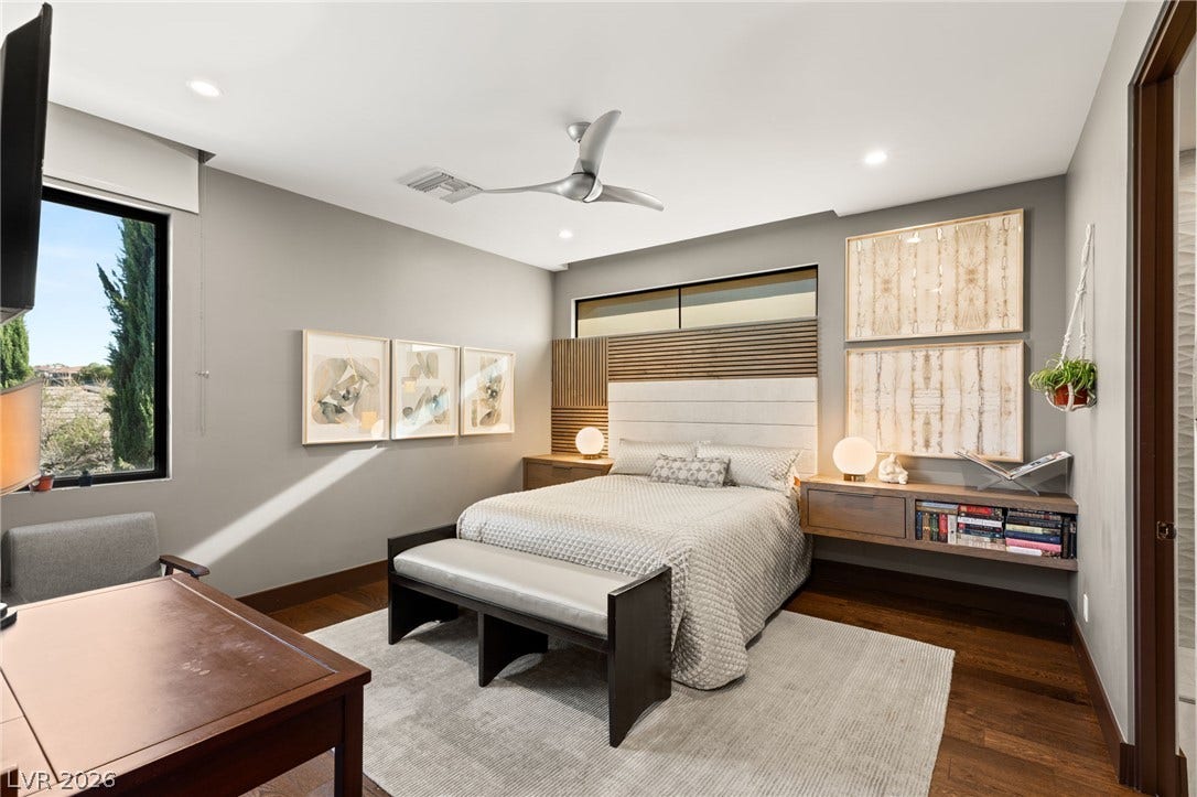1269 Imperia Drive, Henderson, NV 89052 Gleaming hardwood floors and a modern architectural window anchor this peaceful bedroom setting.