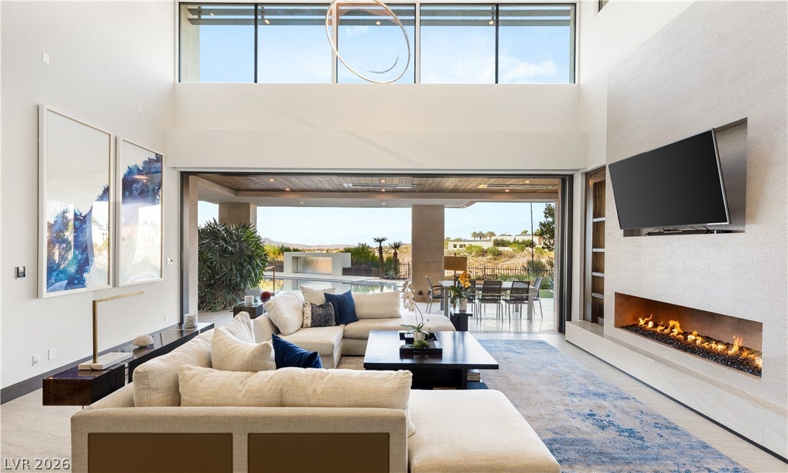 1269 Imperia Drive, Henderson, NV 89052 Retractable glass doors seamlessly connect this airy living space to the scenic outdoor terrace.