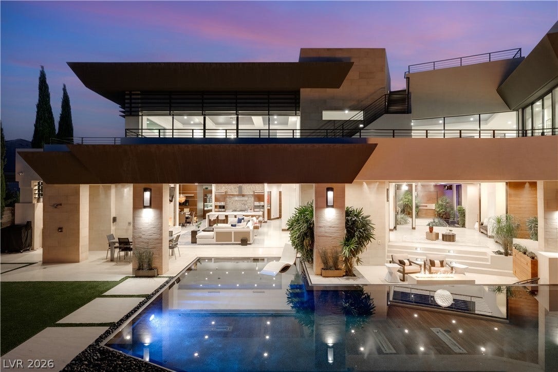 1269 Imperia Drive, Henderson, NV 89052 Striking multi-level architectural design seamlessly integrates indoor and outdoor living areas alongside a sparkling pool.