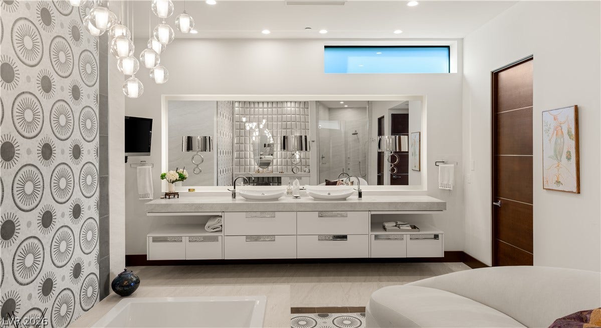 1269 Imperia Drive, Henderson, NV 89052 Clean lines and a floating double vanity define this modern luxury bath.